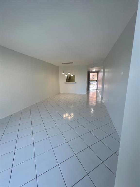 1855 West 60th Street, Unit 325 Hialeah, FL 33012 - Photo 3 of 18 a view of an empty room and window