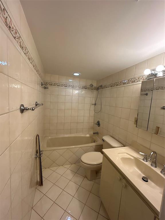 1855 West 60th Street, Unit 325 Hialeah, FL 33012 - Photo 10 of 18 a bathroom with a sink mirror toilet and shower