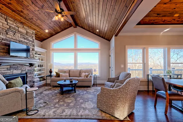 a kitchen with stainless steel appliances a stove a sink and a microwave