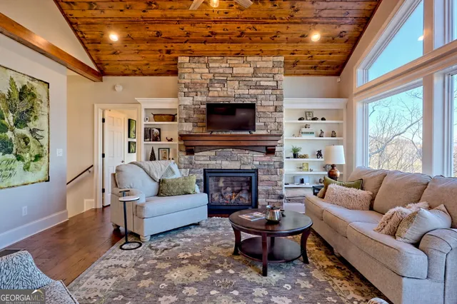 a view of balcony with wooden floor and fence