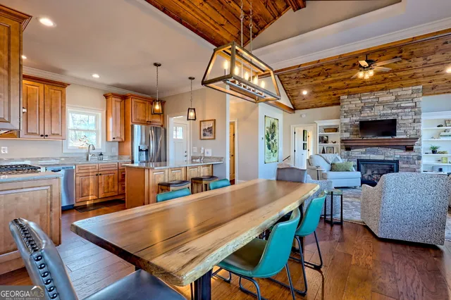 a view of a balcony with wooden floor and fence