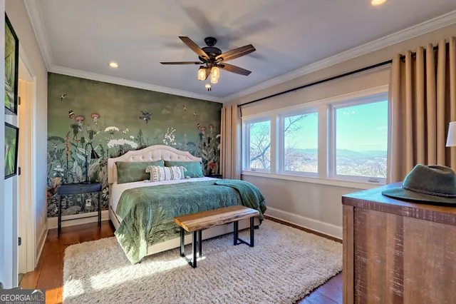 a balcony with wooden floor table and chairs