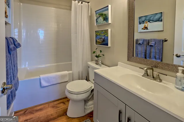 a bedroom with a large bed and a large window