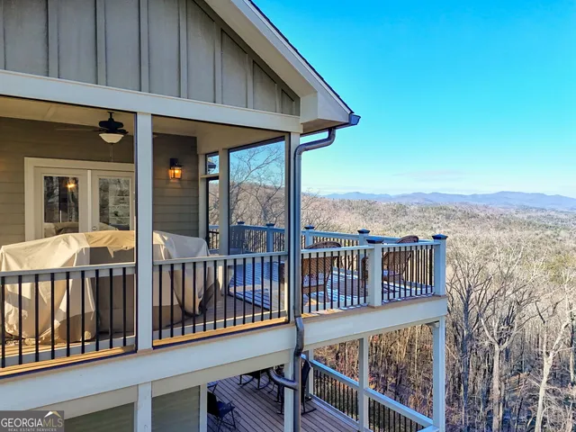 a view of living room with furniture and floor to ceiling window