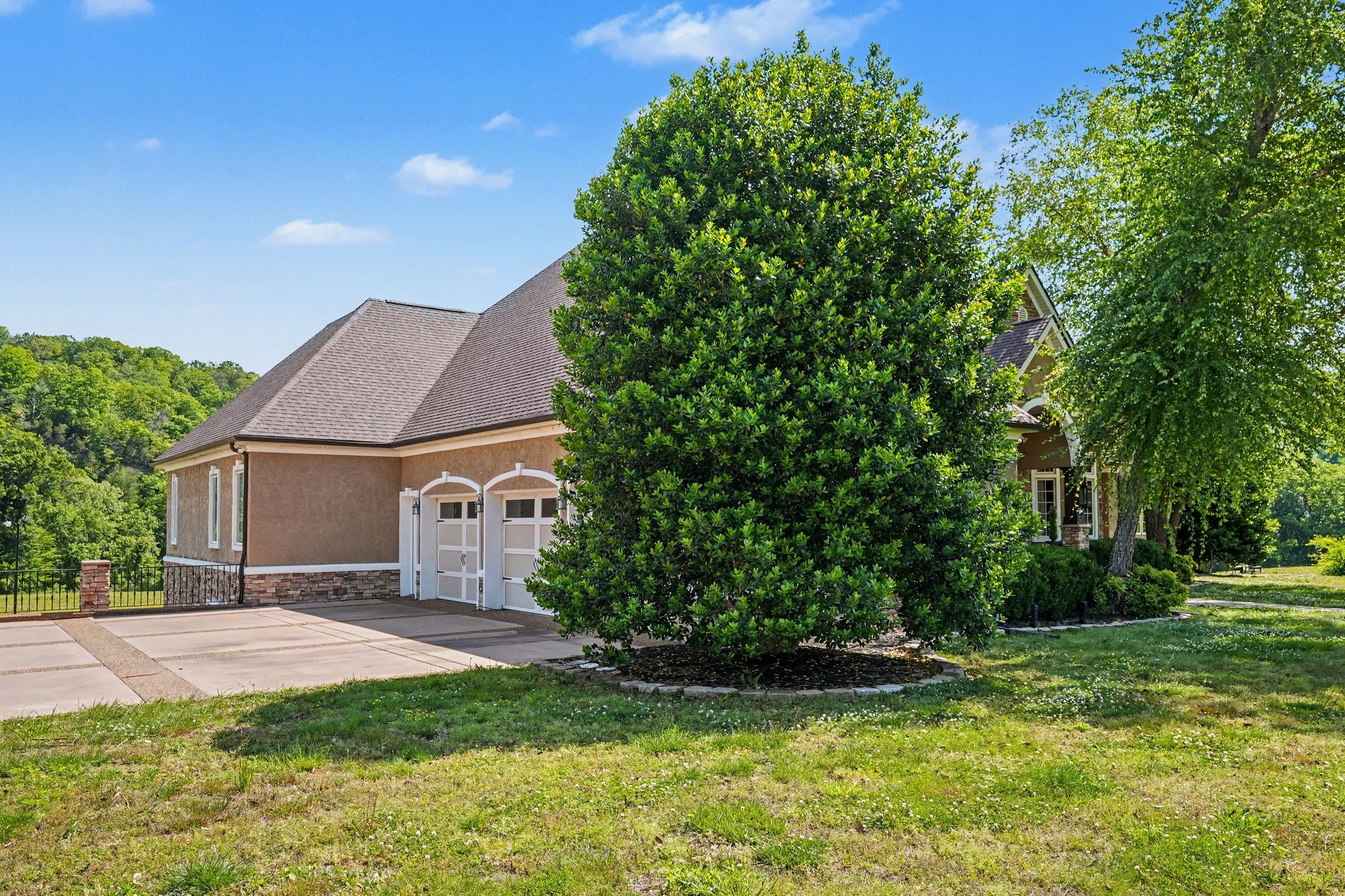 7699 County Line Road North White Bluff, TN 37187 - Photo 16 of 91 a front view of a house with a yard and garage