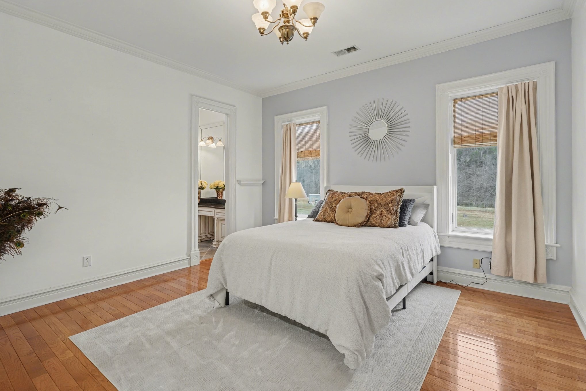 7699 County Line Road North White Bluff, TN 37187 - Photo 62 of 91 a bedroom with a large bed and wooden floor