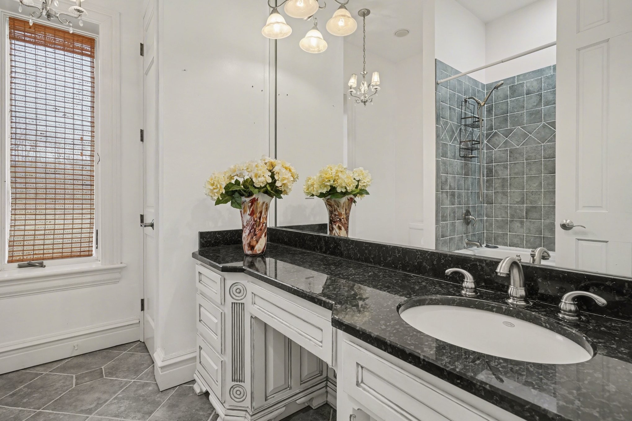 7699 County Line Road North White Bluff, TN 37187 - Photo 63 of 91 a bathroom with a granite countertop sink a mirror and a shower
