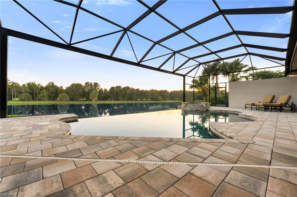 11978 Maidstone Court Naples, FL 34120 - Photo 33 of 44 Infinity Edge Pool and Spa with Lake View