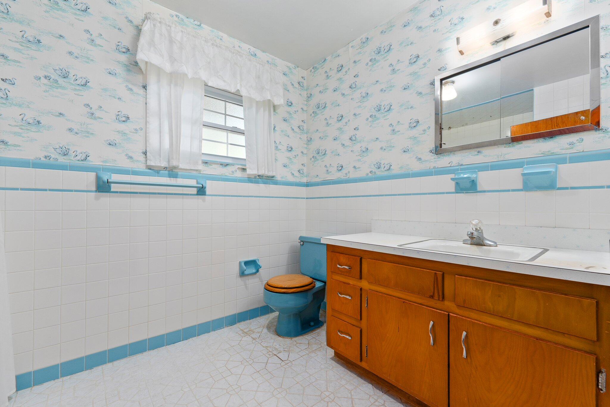 11541 Okeechobee Road Fort Pierce, FL 34945 - Photo 24 of 46 a bathroom with a sink and a stove