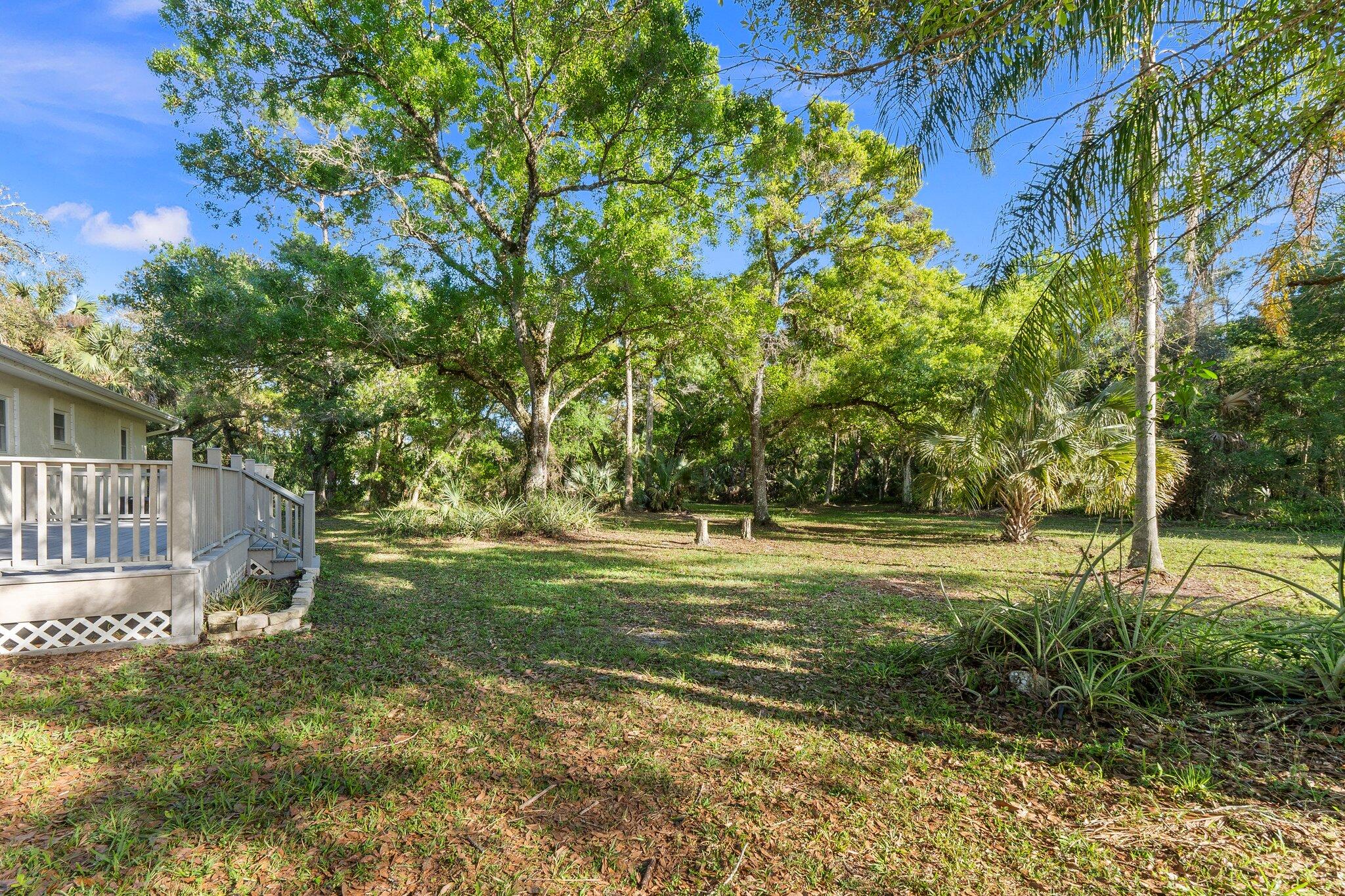 11541 Okeechobee Road Fort Pierce, FL 34945 - Photo 8 of 46 a view of a park with large trees