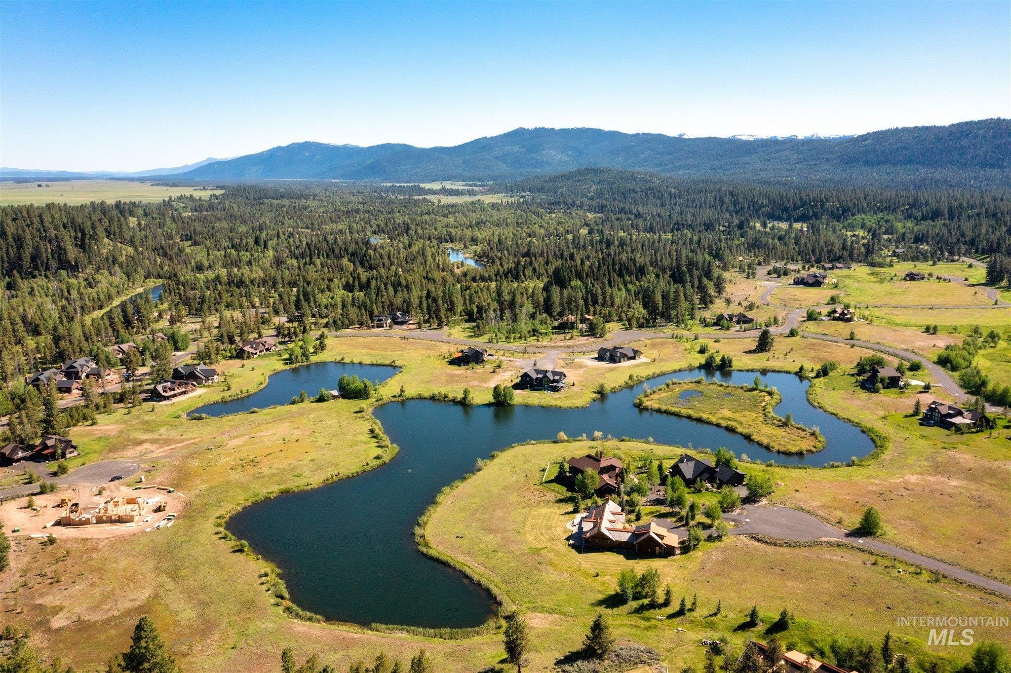 110 Fawnlilly Drive McCall, ID 83638 - Photo 3 of 27 Aerial view of a forest and a water and mountain view