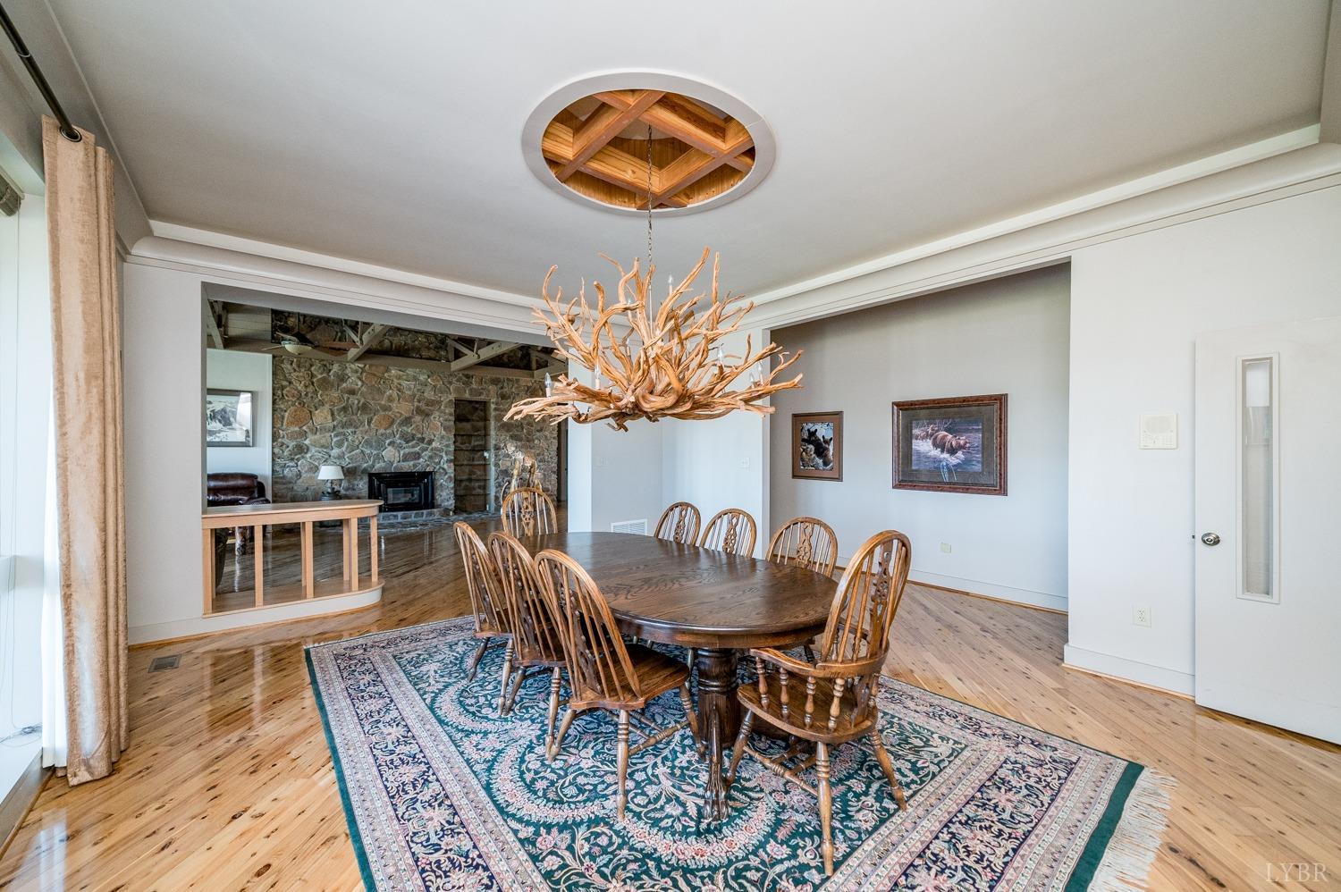 11261 Forest Road Forest, VA 24551 - Photo 32 of 99 a view of a dining room with furniture wooden floor and chandelier