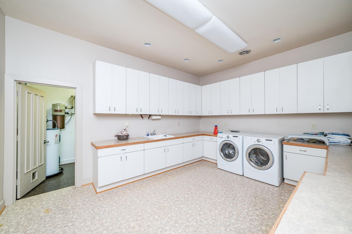 11261 Forest Road Forest, VA 24551 - Photo 52 of 99 a utility room with sink dryer and washer
