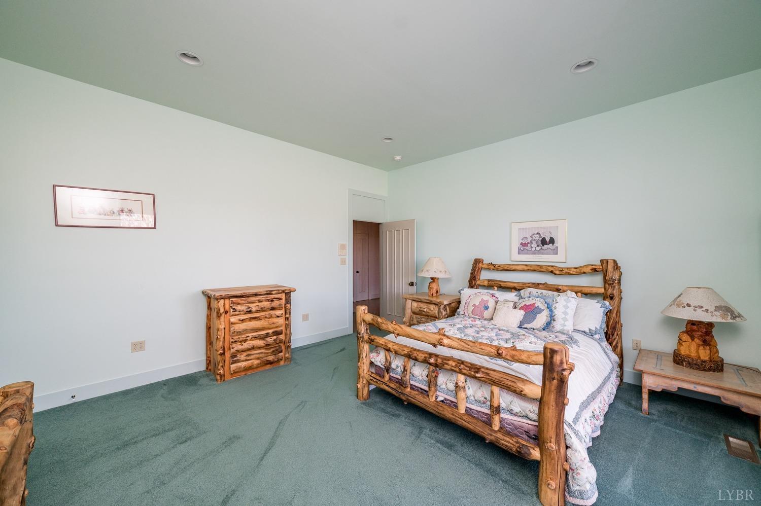 11261 Forest Road Forest, VA 24551 - Photo 56 of 99 a bedroom with a bed and a couch