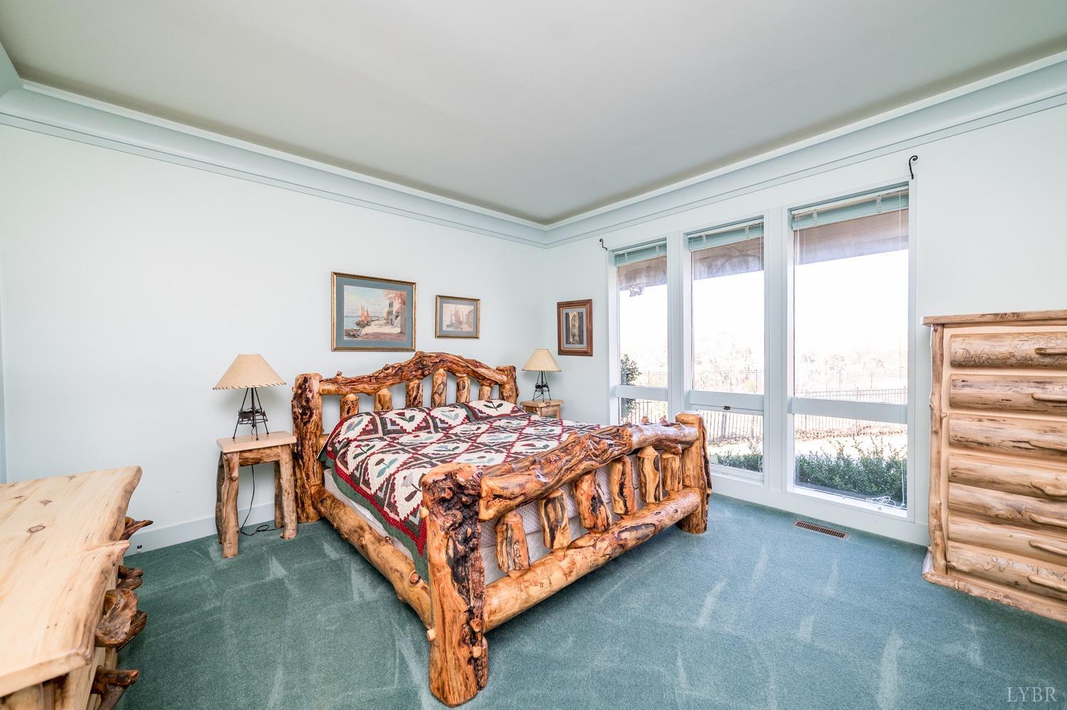 11261 Forest Road Forest, VA 24551 - Photo 61 of 99 a bed room with a bed and a chair