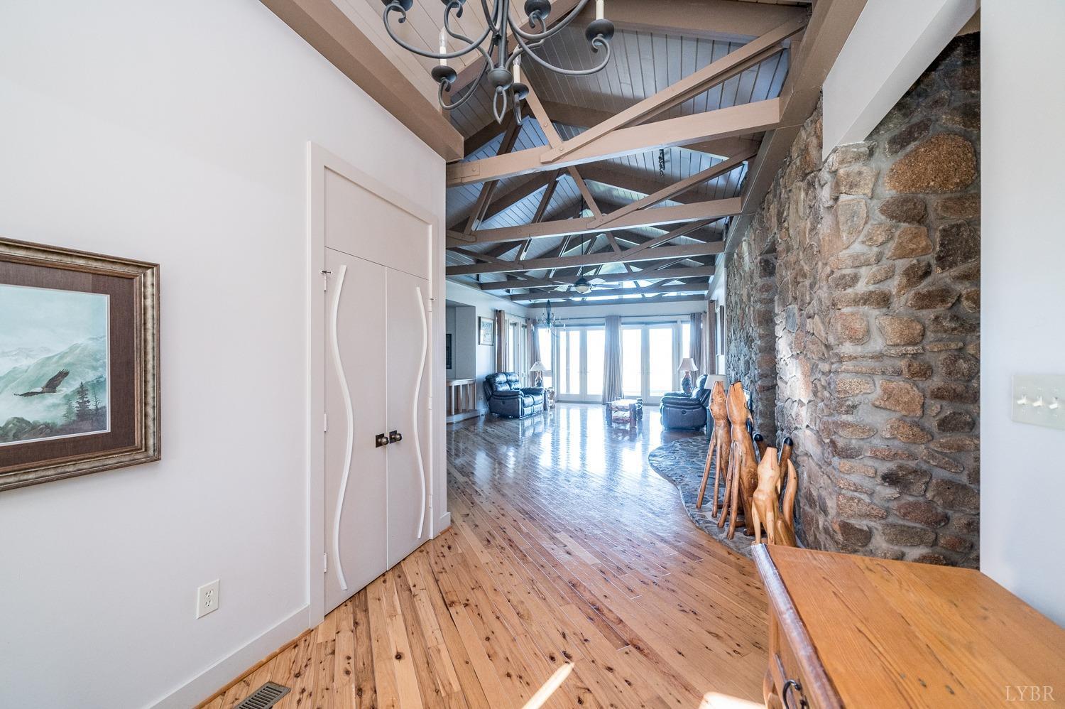 11261 Forest Road Forest, VA 24551 - Photo 79 of 99 a view of a hallway with wooden floor and staircase