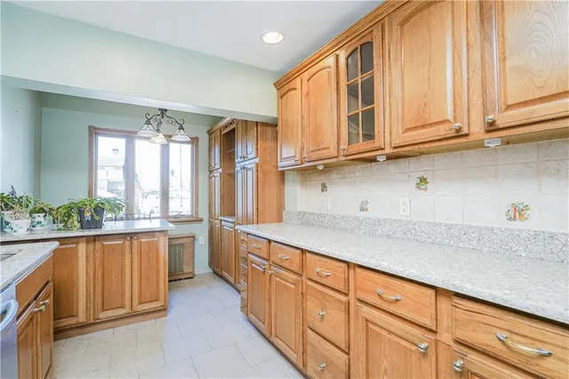 a kitchen with stainless steel appliances granite countertop a sink and cabinets
