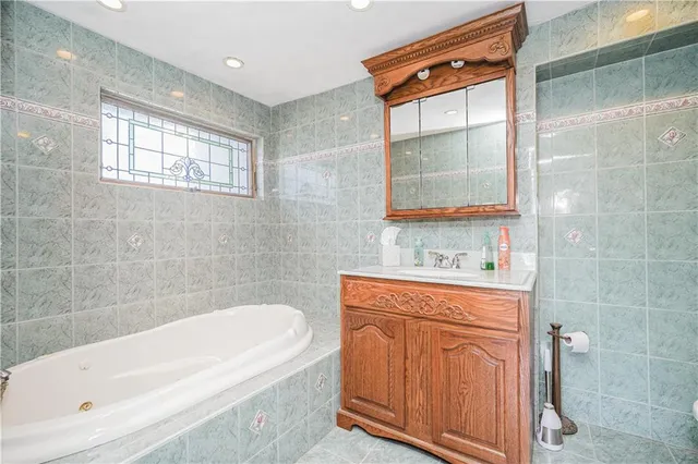 a bathroom with a bathtub and a sink