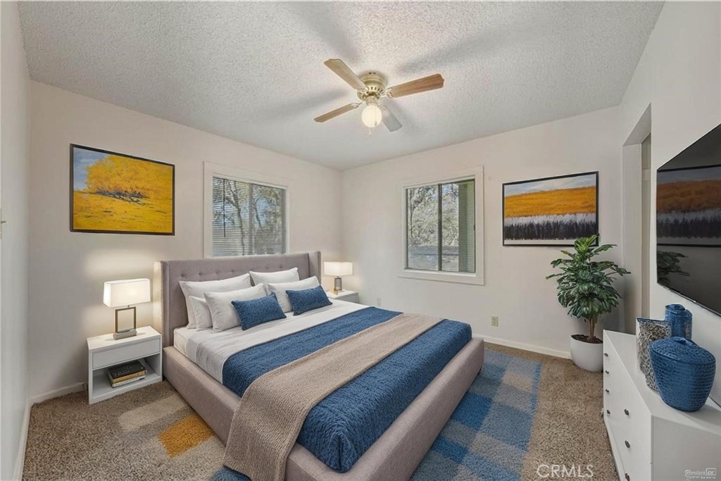 14840 Valley Clearlake, CA 95422 - Photo 15 of 36 a bedroom with a bed and a couch