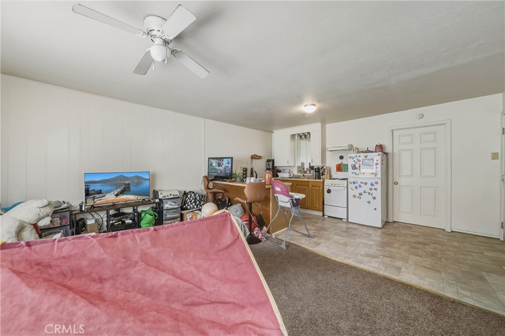 14840 Valley Clearlake, CA 95422 - Photo 20 of 36 a bed room with a bed mirror and a chair