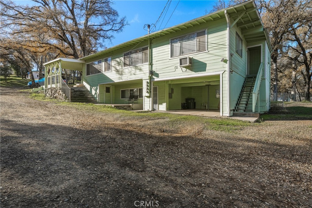 14840 Valley Clearlake, CA 95422 - Photo 2 of 36 a view of a house with a yard
