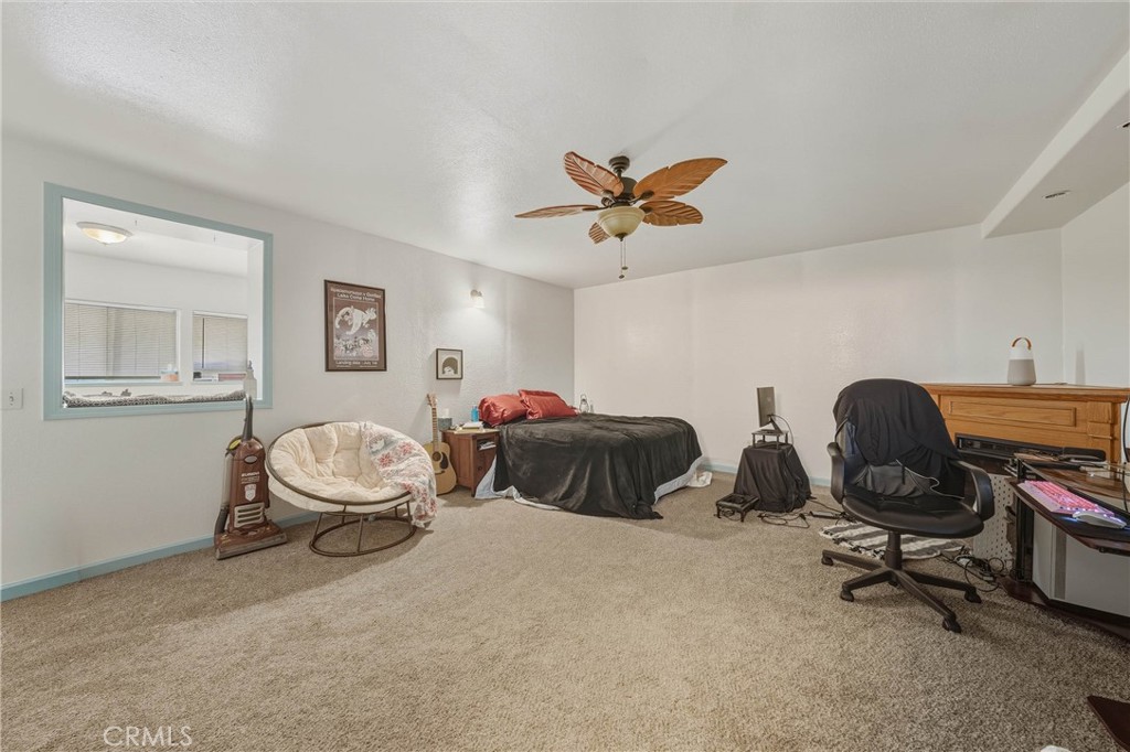 14840 Valley Clearlake, CA 95422 - Photo 25 of 36 a bedroom with furniture and a window