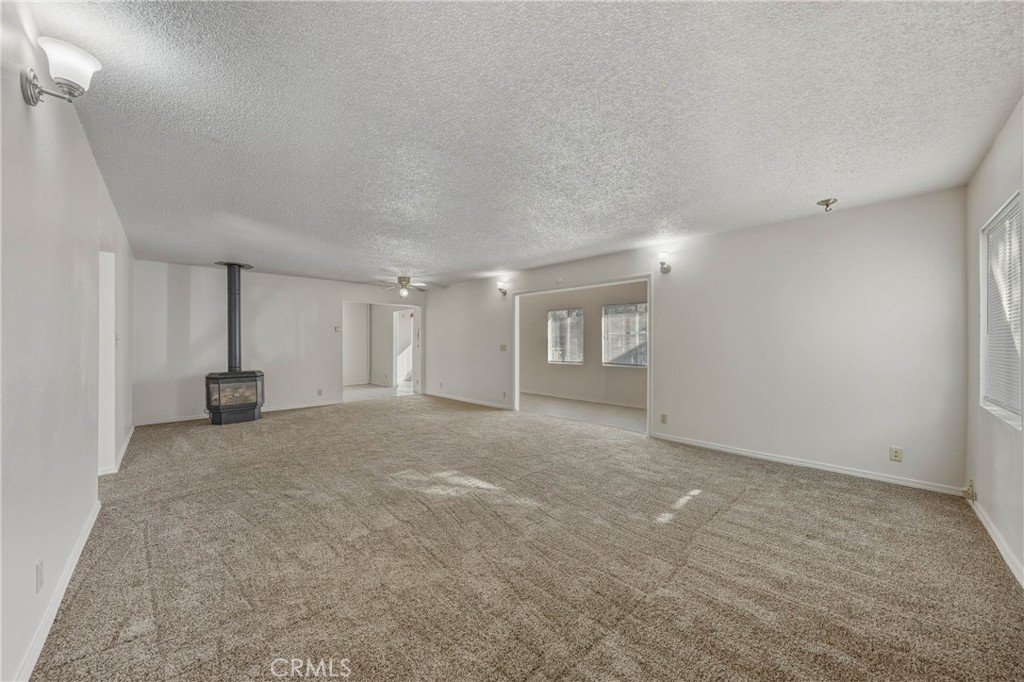 14840 Valley Clearlake, CA 95422 - Photo 10 of 36 a view of a big room with windows and cabinet