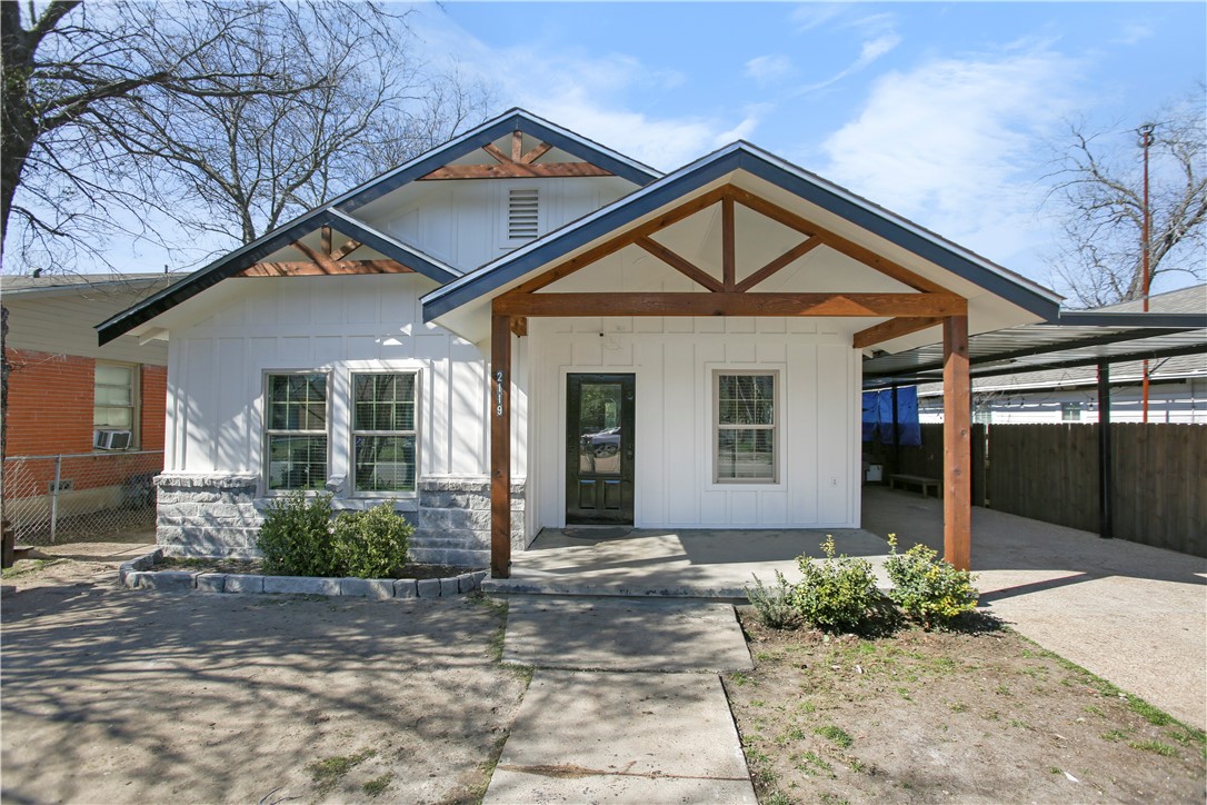 2119 Summer Avenue Waco, TX 76708 - Photo 1 of 32 a front view of a house with garden