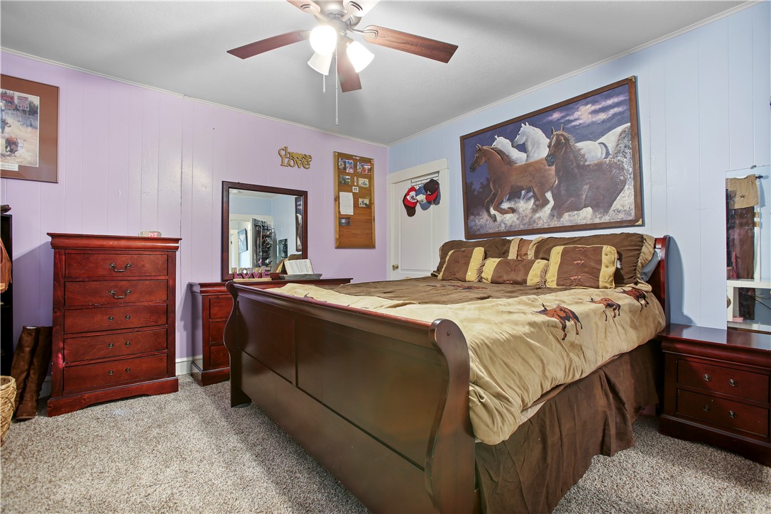 2119 Summer Avenue Waco, TX 76708 - Photo 16 of 32 a bedroom with a bed and a dresser