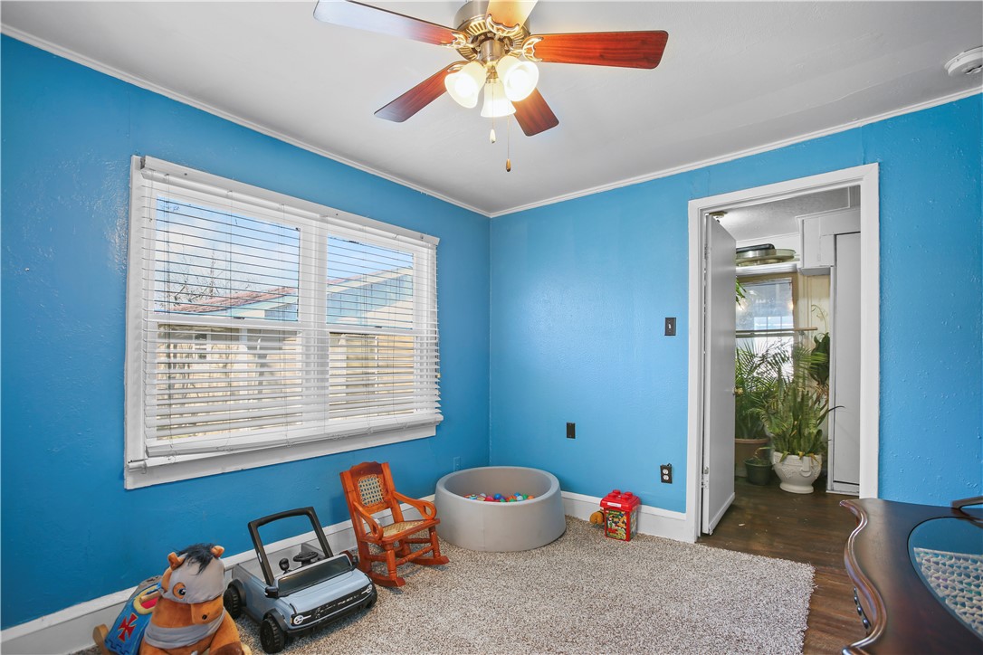 2119 Summer Avenue Waco, TX 76708 - Photo 23 of 32 a bedroom with furniture and a window