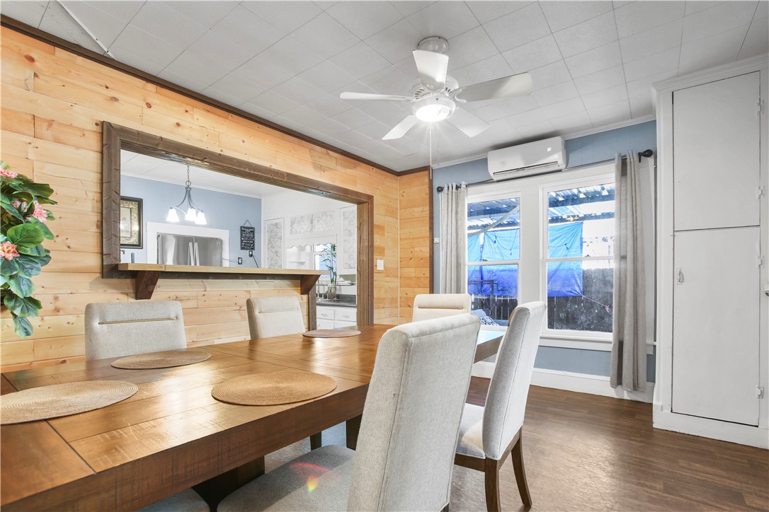 2119 Summer Avenue Waco, TX 76708 - Photo 9 of 32 a view of a dining room with furniture wooden floor and chandelier