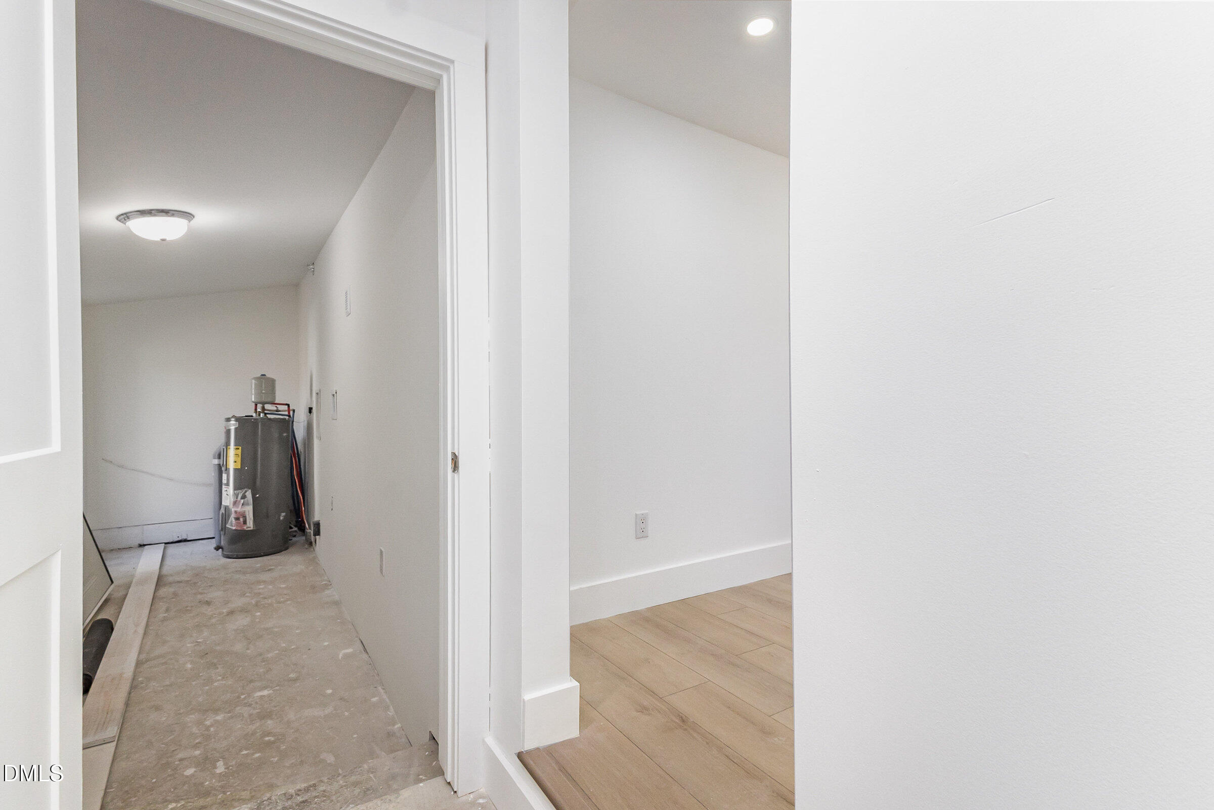 1568 Petty Road Graham, NC 27253 - Photo 25 of 51 a view of a hallway with wooden floor and a bathroom