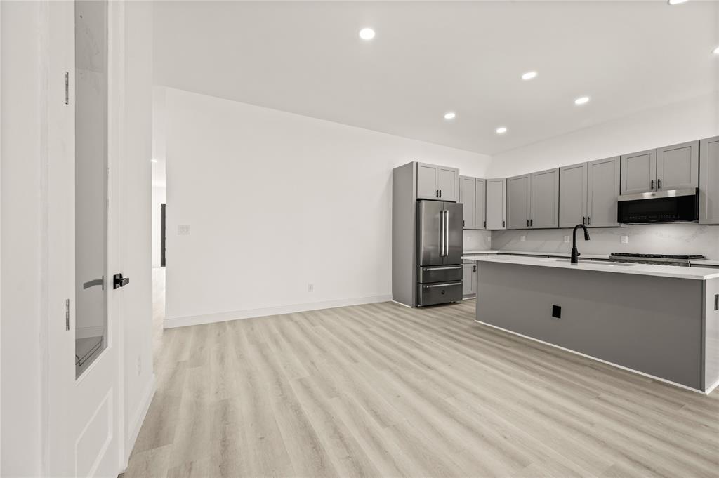 3323 Reed Lane Dallas, TX 75215 - Photo 11 of 33 a view of kitchen with stainless steel appliances refrigerator oven and cabinets