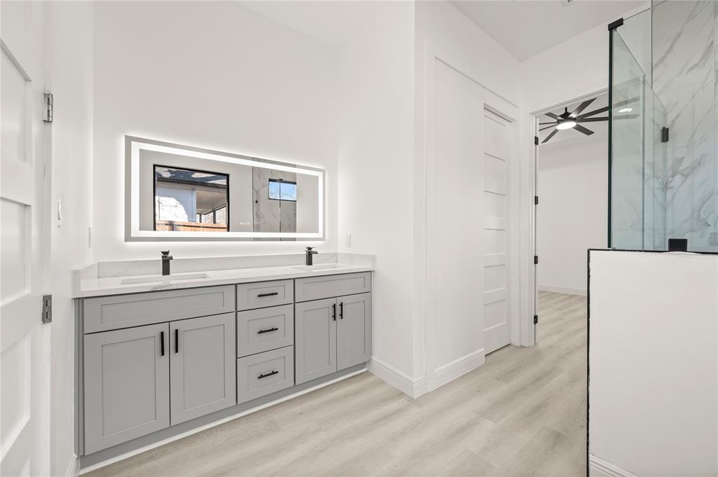 3323 Reed Lane Dallas, TX 75215 - Photo 21 of 33 a bathroom with a double vanity sink and mirror