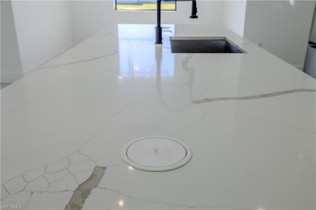 3303 24th Street Southwest Lehigh Acres, FL 33976 - Photo 7 of 25 a bathroom with a sink a toilet and mirror