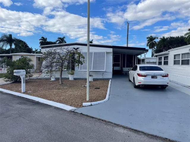 a view of a car park in front of house