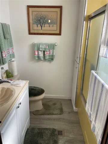 a bathroom with a sink and toilet