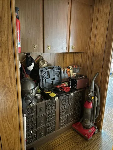 a room with wooden floor and shoes