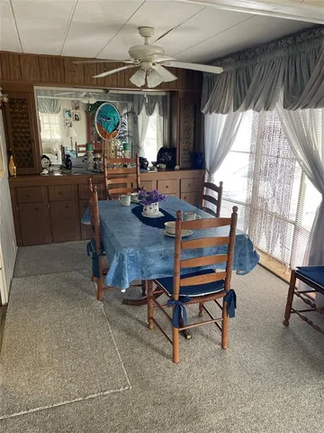 a living room with furniture and a clock