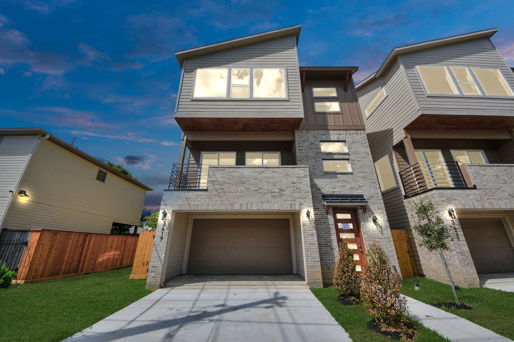 a front view of a house with a yard