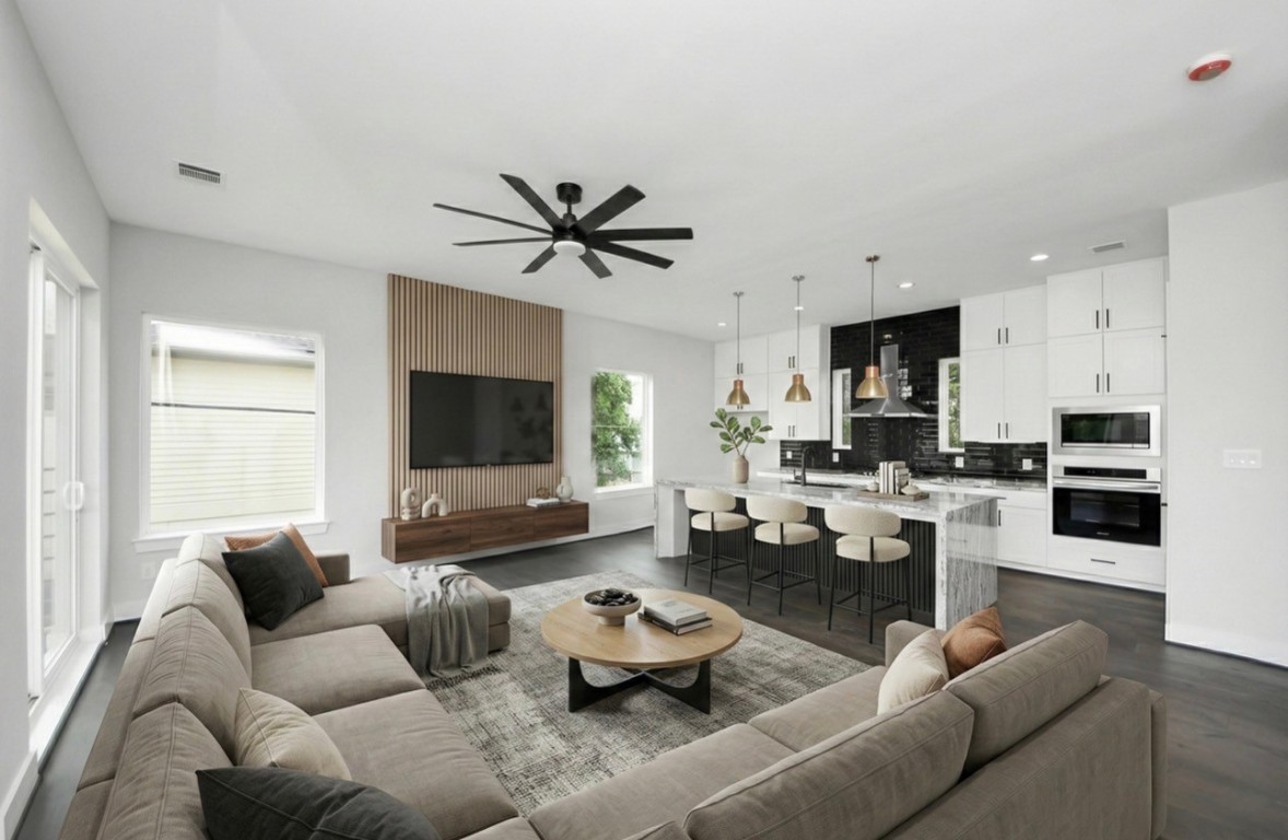 3419 Arlington Street Houston, TX 77018 - Photo 3 of 44 a living room with furniture and a flat screen tv