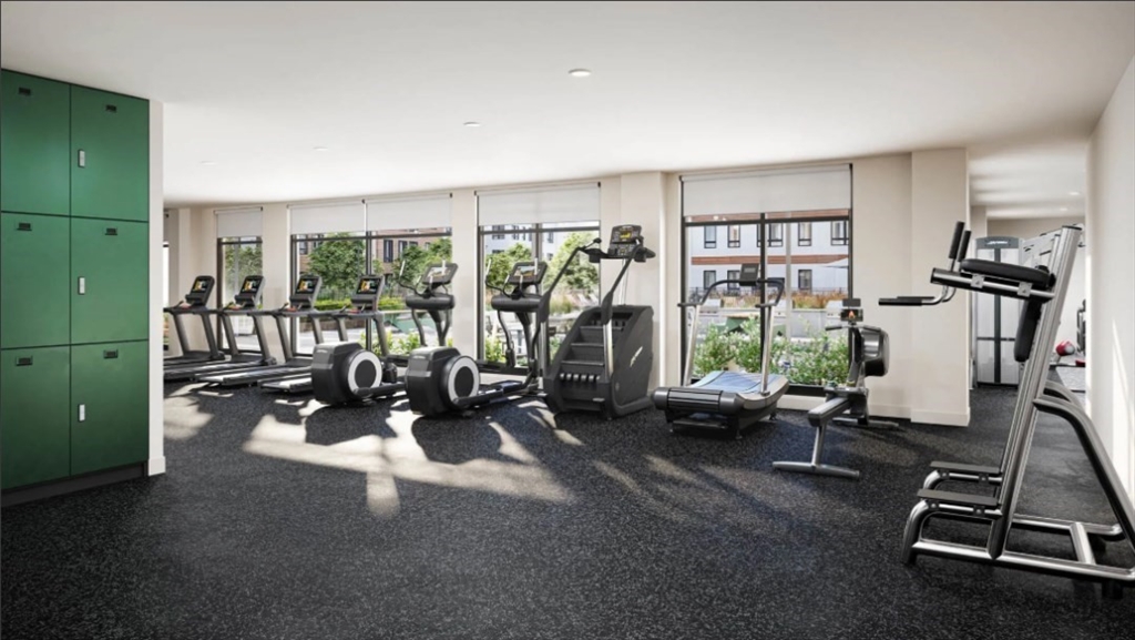 200 Quannapowitt Parkway, Unit 3121 Wakefield, MA 01880 - Photo 12 of 12 a living room with furniture a window and gym equipment