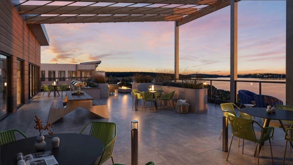 200 Quannapowitt Parkway, Unit 3121 Wakefield, MA 01880 - Photo 10 of 12 a roof deck with table and chairs