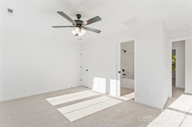 a view of a room with a fan