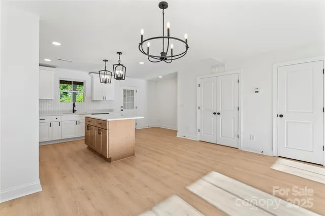 a view of a kitchen with electric appliances