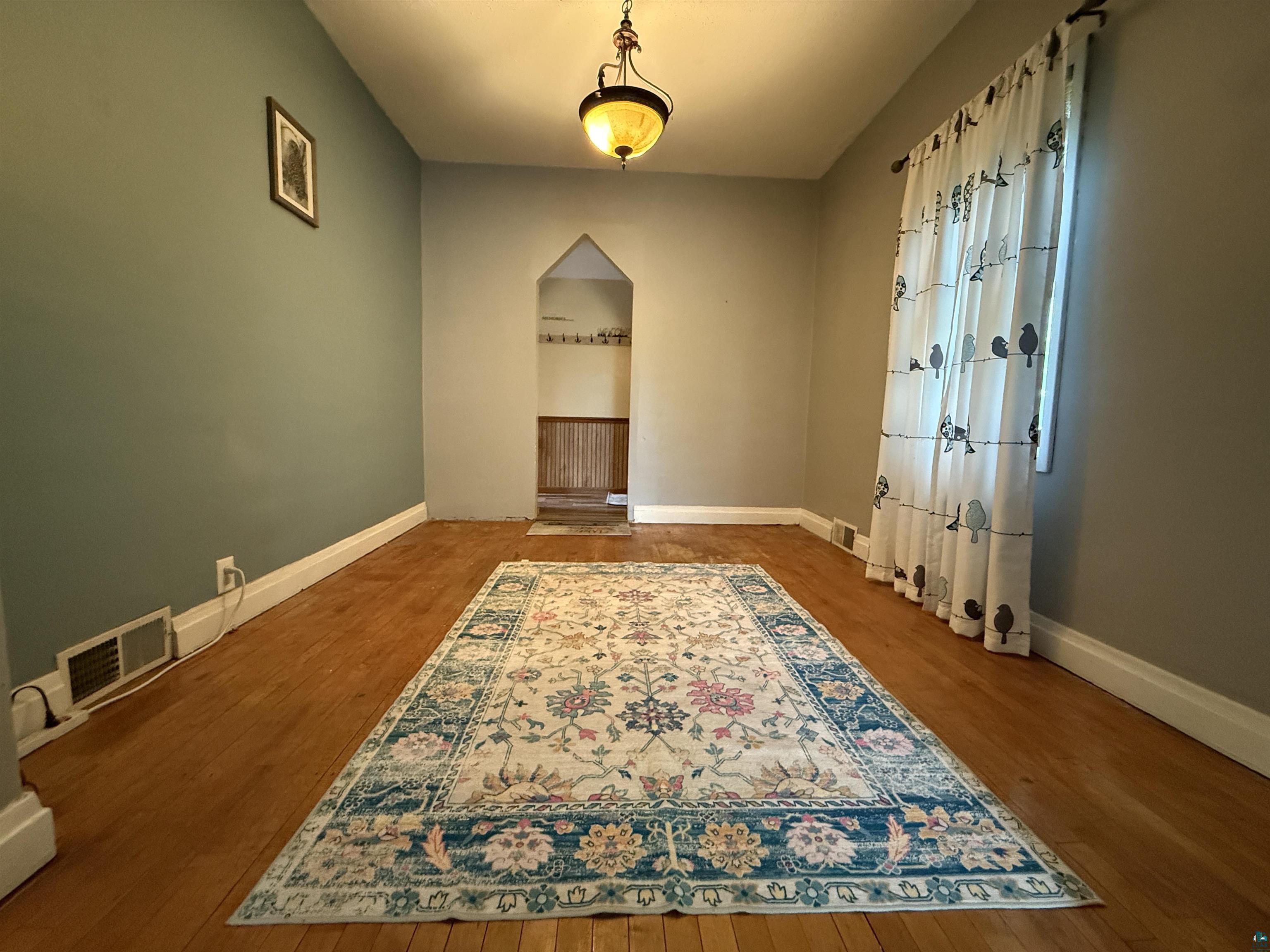 809 16th Street North Virginia, MN 55792 - Photo 16 of 44 Unfurnished room with baseboards and wood finished floors