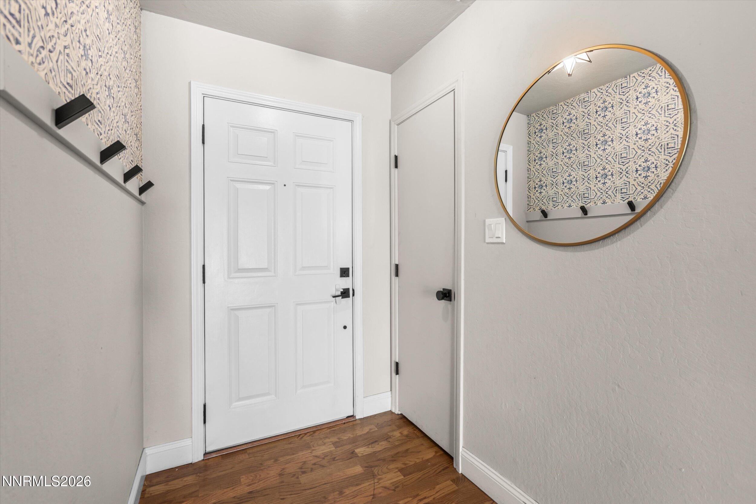 2300 Dickerson Road, Unit 51 Reno, NV 89503 - Photo 3 of 46 an entryway view with wooden floor and a chandelier