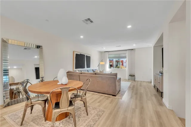 a bedroom with a bed and flat screen tv