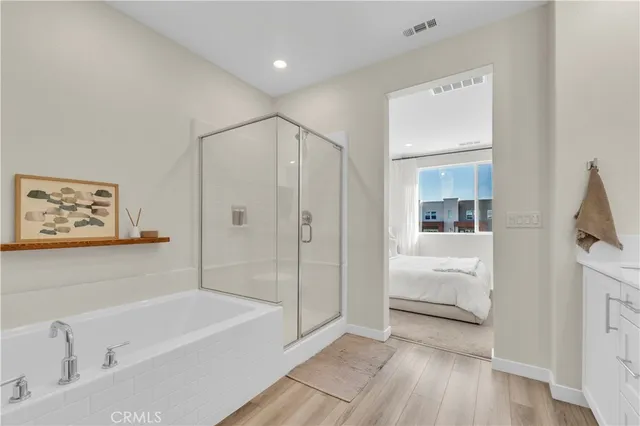 a bedroom with a bed and a book shelf