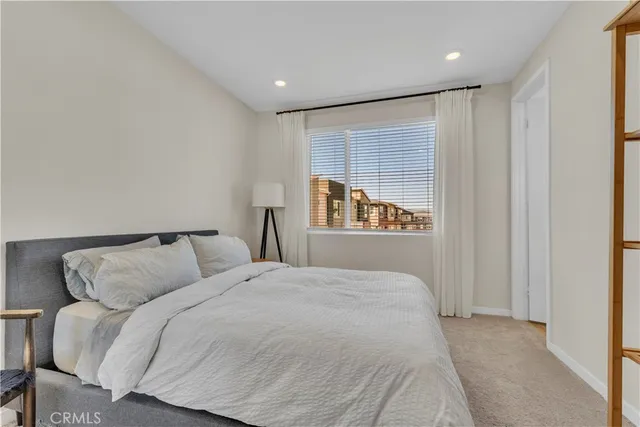 a bathroom with a granite countertop sink toilet and mirror